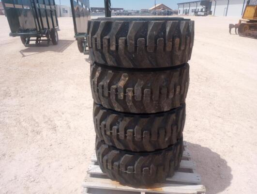 (4) Unused Skid Steer Wheels w/Caterpillar Tires 12-16.5